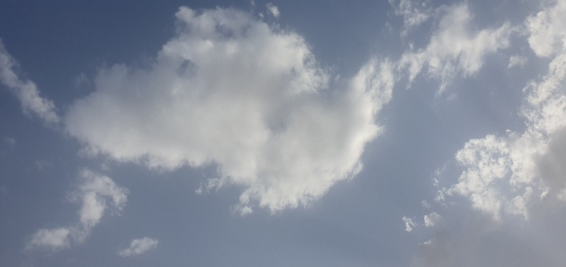 Series of blue sky photos showing subtle changes in light and cloud patterns.